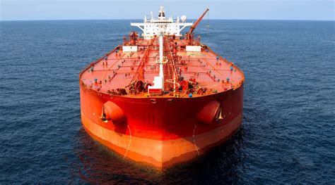 An large red oil tanker requires large ship financing services | Tug ...