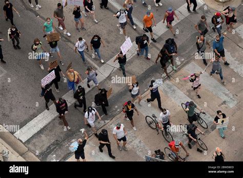 Austin, Texas, USA. 31st May, 2020. Protesters march down 12th Street ...