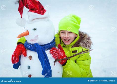 Fun, Happy Kid Playing with Snowman in Winter Park Stock Image - Image of gloves, beautiful ...