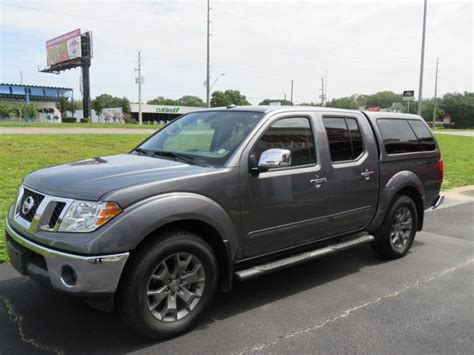 Nissan Frontier LEER 100XL with Nerf Bars - TopperKING : TopperKING | Providing all of Tampa Bay ...