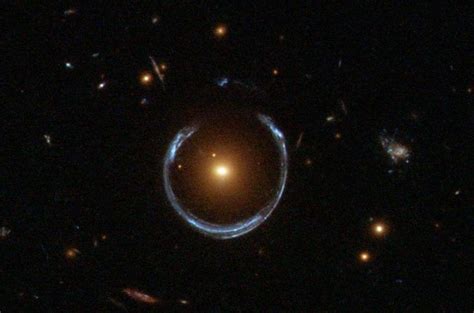 The Cosmic Horseshoe, an example of an Einstein ring. Image via ESA ...