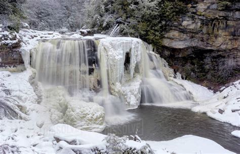 USA, West Virginia, Blackwater Falls State Park. Waterfall in winter ...