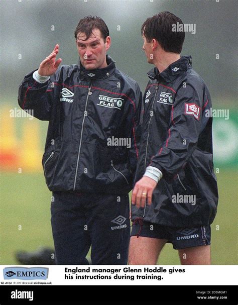 England manager Glenn Hoddle gives his instructions to Glenn Roeder during training Stock Photo ...