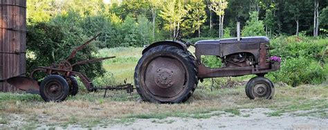 Old Rusty Tractor and farm equipment Photograph by Jo-Ann Matthews - Fine Art America