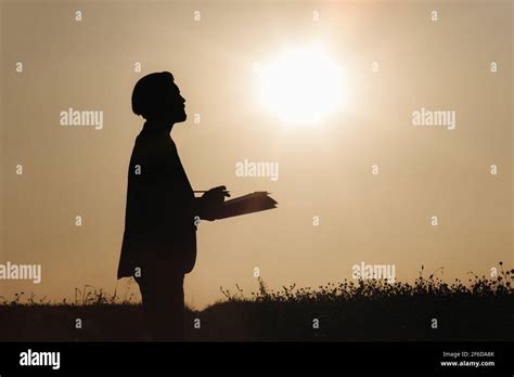 Silhouette of farmer on field Stock Photo - Alamy