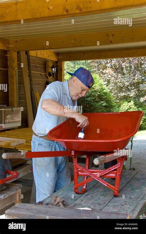 Red wheelbarrow and painting hi-res stock photography and images - Alamy