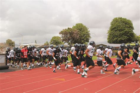 Football Players Running – Generations Magazine – June – July 2013 | Generations Magazine