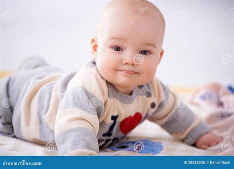 Contented Little Baby Smiling at the Camera Stock Photo - Image of closeup, stomach: 28552236