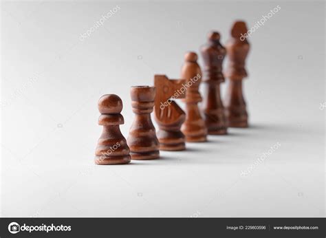 Chess Pieces Light Background Stock Photo by ©serezniy 229803596