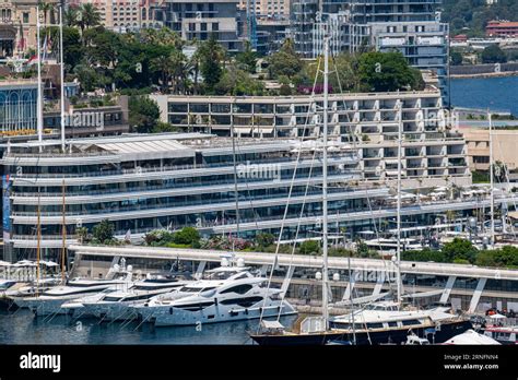 Luxury yachts in the port of Monaco with the Monaco Yacht Club behind ...