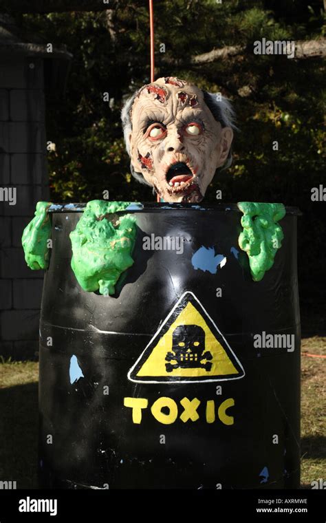 Halloween - man in toxic waste barrel Stock Photo - Alamy