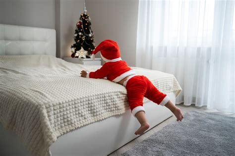 Free Photo | Full shot baby wearing santa outfit