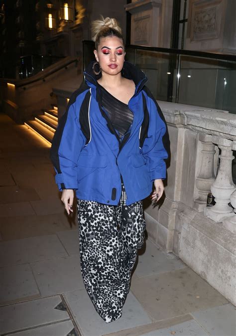 Mabel in a Revealing Mesh Top and Flared Trousers - Soho in London 11/28/2020 • CelebMafia