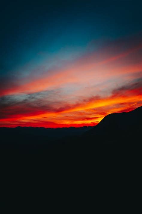 Silhouette of Mountain During Sunset · Free Stock Photo