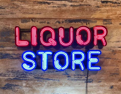 Neon Liquor Store Sign - Kemp London - Bespoke neon signs and prop hire.