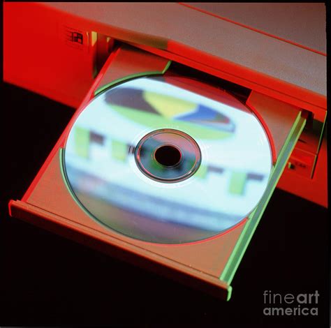 Compact Disc In A Computer Cd-rom Disc Drive Photograph by Steve Horrell/science Photo Library