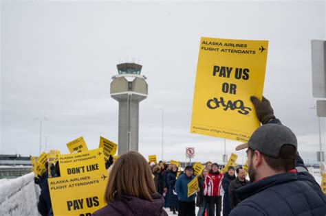 Alaska Airlines flight attendants protest at Anchorage airport as strike vote looms - Alaska ...