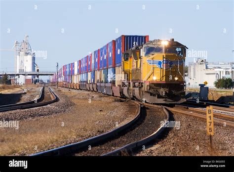 An eastbound Union Pacific intermodal freight train rolls through ...