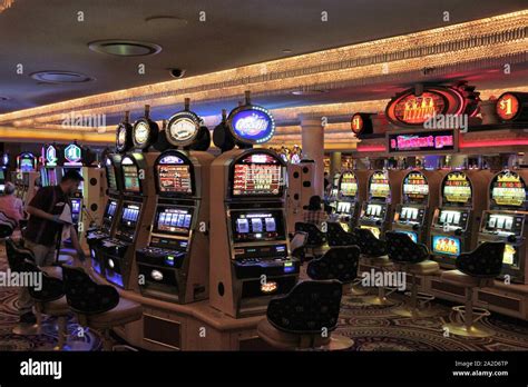 LAS VEGAS, USA - APRIL 14, 2014: People visit slot machines at Caesar's ...