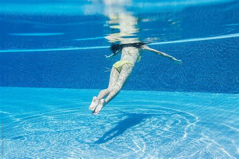 "Woman Diving, Underwater View." by Stocksy Contributor "Michela ...