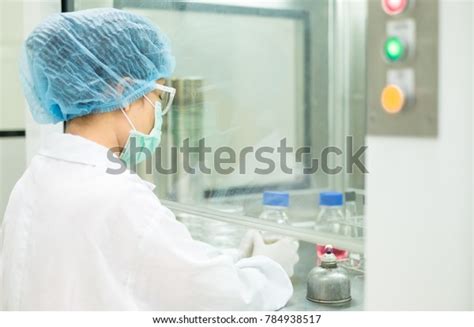 Microbiologist Testing Microbial Contamination Sample Under Stock Photo ...