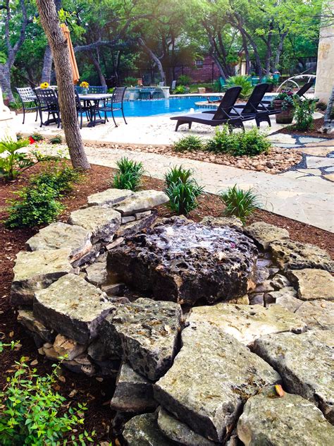 Water Feature in Backyard Oasis | Boulders water feature, Water ...