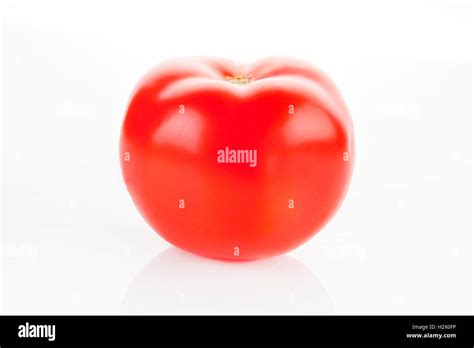 Ripe tomato isolated Stock Photo - Alamy