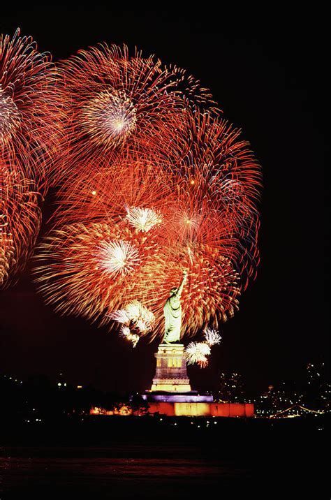 Statue Of Liberty With Fireworks Photograph by Jupiterimages - Pixels