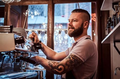 Premium Photo | Cheerful barista with stylish beard and hairstyle ...