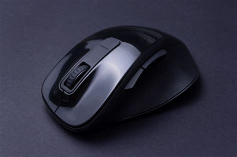 Premium Photo | Black computer mouse on black