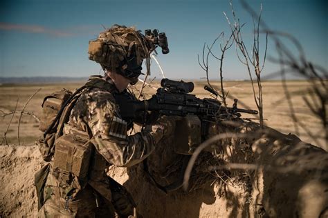 Member of the 75th Ranger Regiment stands watch with his Mk.48 Machine Gun while conducting ...