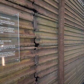 An actual US/Mexico border fence that encloses the installation ...