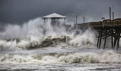 Florence, a wet and unwanted visitor, besieges Carolinas