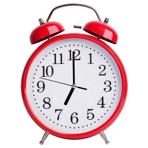 Alarm clock shows exactly seven o'clock 3512806 Stock Photo at Vecteezy