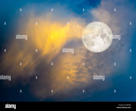 Gold cloud in the blue sky light of sunset in evening Stock Photo - Alamy