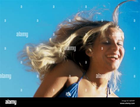 Laughing woman at beach Stock Photo - Alamy