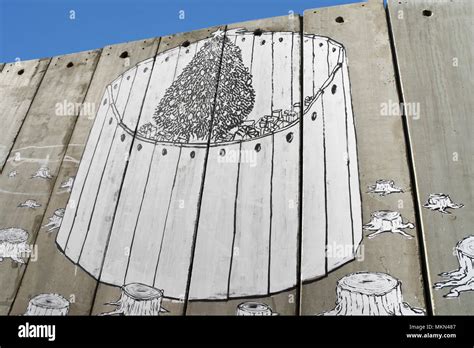 A banksy graffiti on the separation wall, Bethlehem, Palestine Stock Photo - Alamy