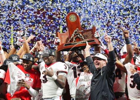 No. 6 Georgia holds the SEC Championship trophy after win over No. 4 ...