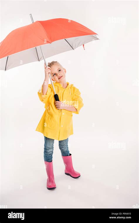 little child in yellow raincoat with umbrella, isolated on white Stock Photo - Alamy