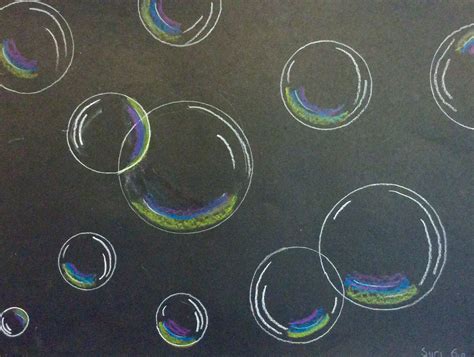 soap bubbles are drawn on a black surface