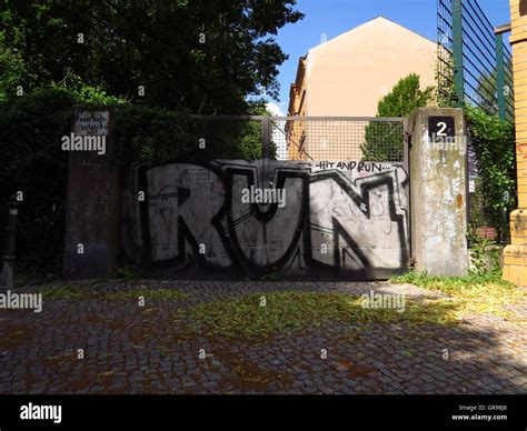 Graffiti On Metal Gate Stock Photo - Alamy