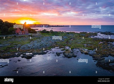 aerial view of svaneke lighthouse at coast during sunset on bornholm denmark Stock Photo - Alamy