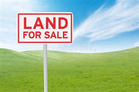 Signboard with land for sale text. Real estate concept. Land For Sale ...