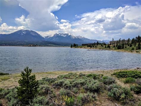 Lake Dillon in Colorado USA with Cloud Covered Rocky Mountains in Distance and Sailboats in the ...