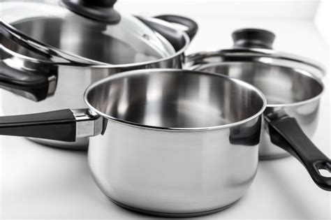 Premium Photo | Stainless steel pots and pans isolated on white