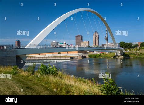 The Des Moines River Dam and downtown pedestrian bridge in Des Moines ...