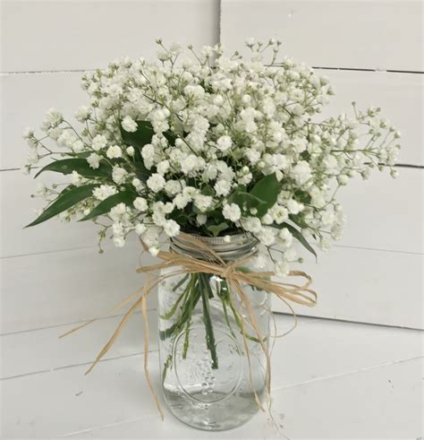 Mason Jar Centerpieces with Babies breath, ruscus, and raffia ...