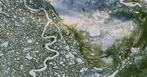 [Aerial] Aerial view of the MacKenzie River Delta and the town of ...