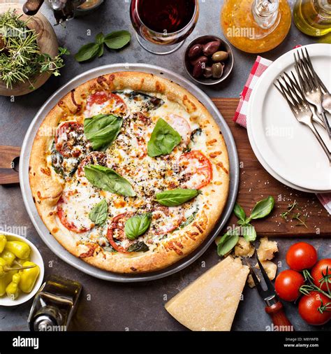 Margherita pizza with basil Stock Photo - Alamy