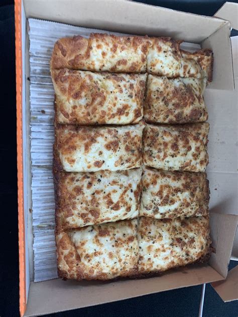 a box filled with sliced up pizza sitting on top of a table